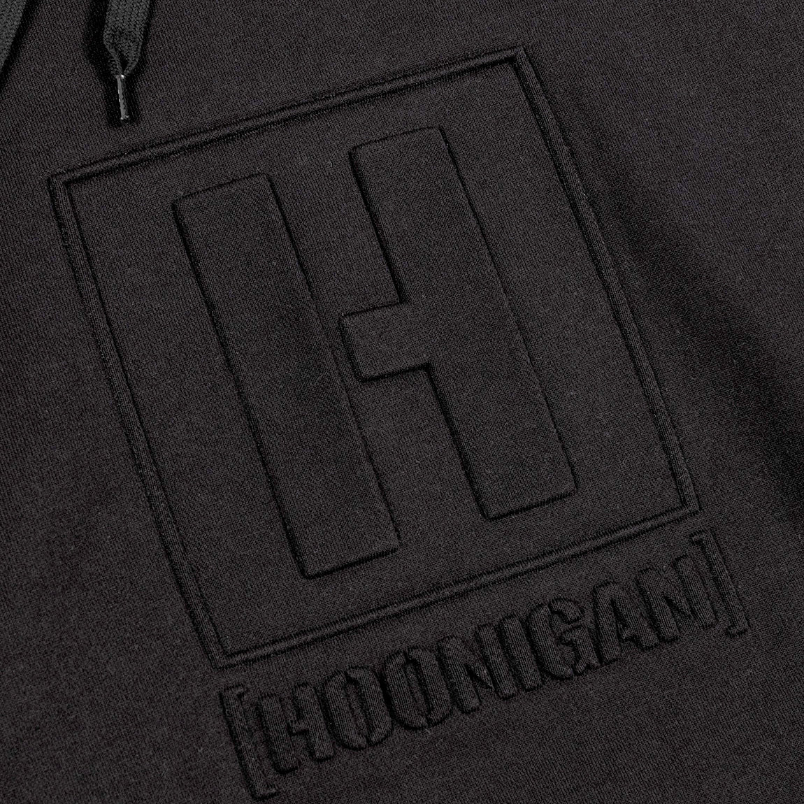 Hoonigan EMBOSSED H-BOX Hoodie in black with embossed logo on the chest, featuring a drawstring hood and kangaroo pocket.