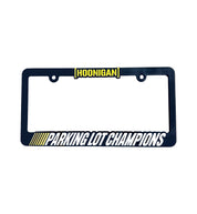 Hoonigan PARKING LOT CHAMPIONS black license plate frame with yellow text, showcasing a sporty design for car enthusiasts.