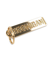 Gold Hoonigan metal keychain featuring a bold logo design, perfect for automotive enthusiasts and car culture fans.