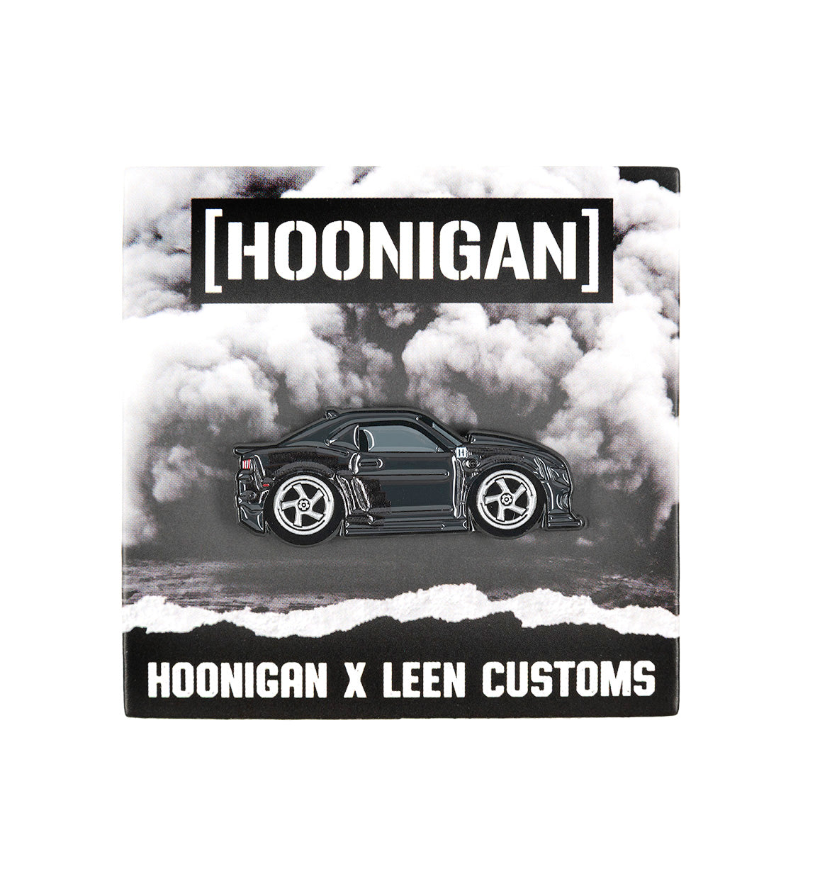 Hoonigan x Leen Customs COALMARO collectible pin featuring a detailed black car design on a cloud background.