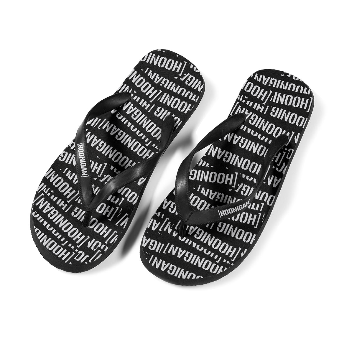 Hoonigan SCATTER flip flops featuring a black and gray design with bold logo and graphics.