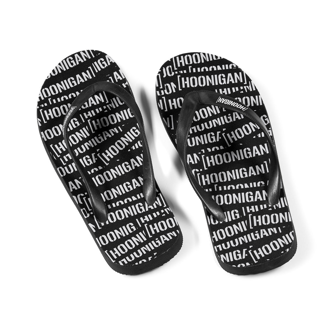 Hoonigan SCATTER flip flops with a black and gray design featuring a bold logo on the footbed.