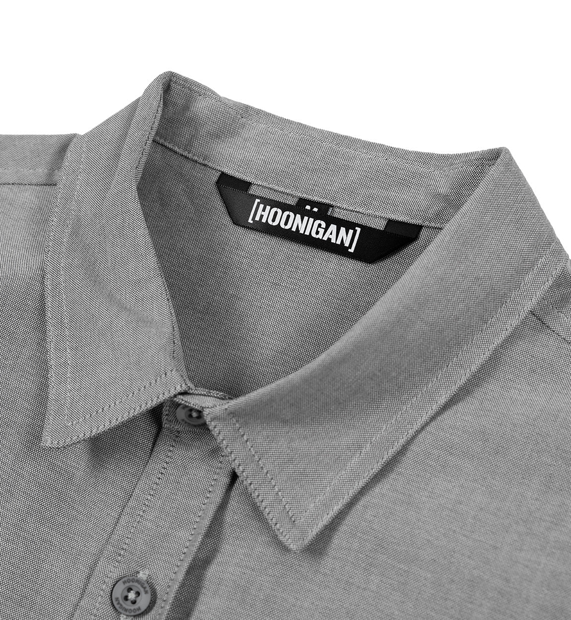 Hoonigan DONUT GARAGE gray woven short sleeve button-up shirt with contrasting logo detail on chest.
