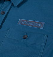 Hoonigan DONUT GARAGE navy short sleeve button-up shirt featuring a woven design and Hoonigan logo.
