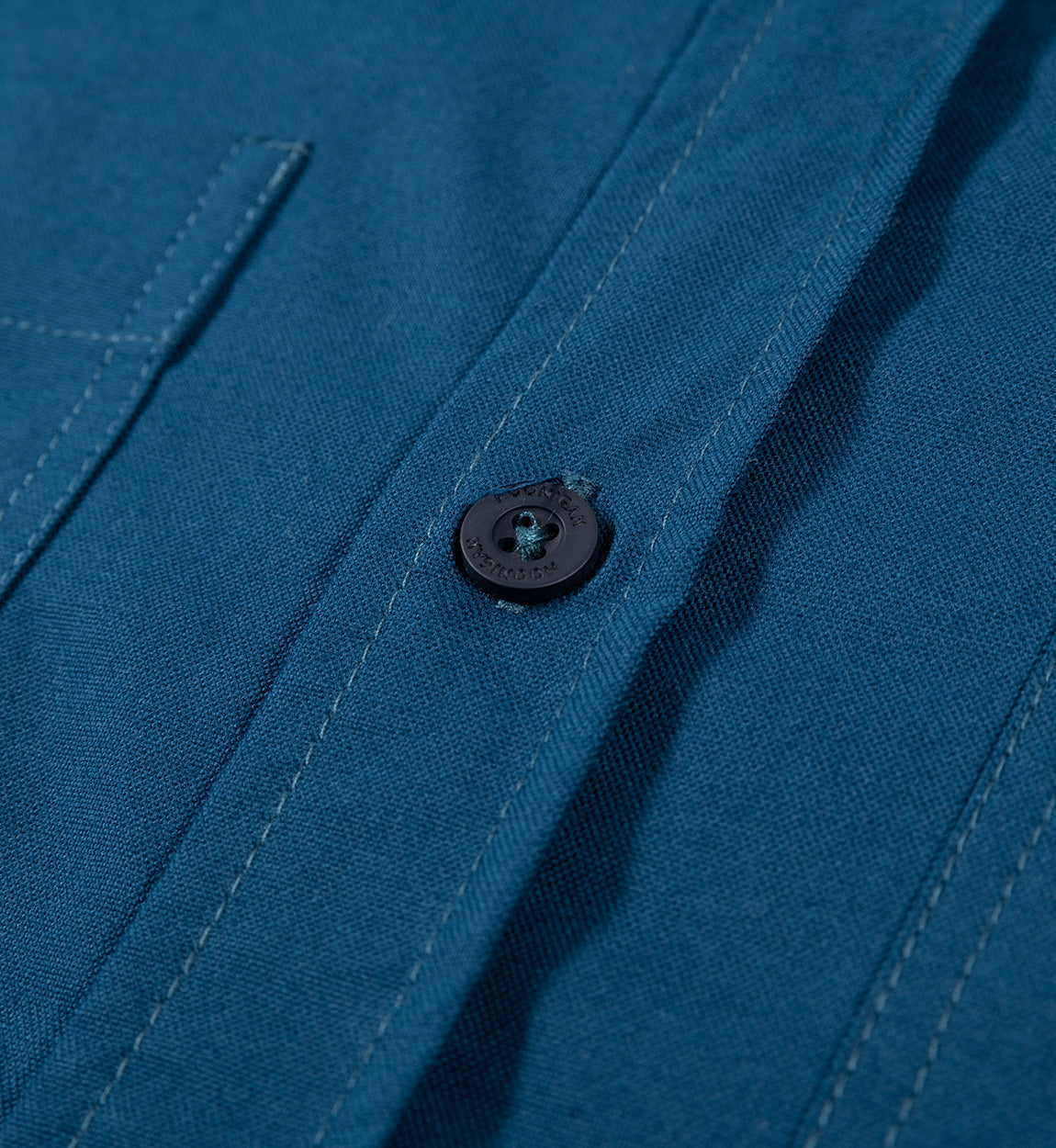 Hoonigan DONUT GARAGE woven short sleeve button-up shirt in navy blue with a casual, stylish design featuring a button-down collar.