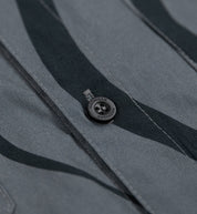 Hoonigan ESSES woven short sleeve button-up shirt in black and gray with a modern design, featuring a button-front closure and a relaxed fit.