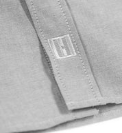 Hoonigan DONUT GARAGE woven long sleeve button-up shirt in heather gray, featuring a classic collar and front button closure.