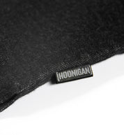 Hoonigan DONUT GARAGE black woven short sleeve button-up shirt featuring a graphic logo on the left chest.