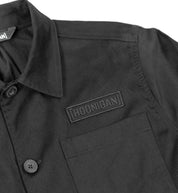 Hoonigan CHORE Jacket in black, featuring a front zipper, large pockets, and logo detailing on the chest.