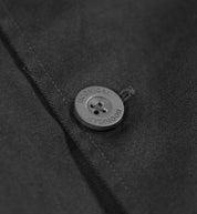 Hoonigan CHORE Jacket in black, featuring a front zip closure and multiple pockets, displayed against a neutral background.