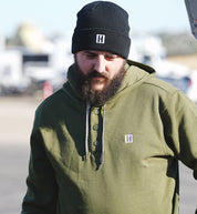Hoonigan HILL CLIMB Henley Fleece Hoodie in olive green, featuring a button-up collar and ribbed cuffs, displayed against a neutral background.