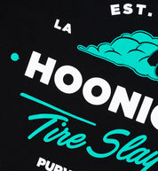 Hoonigan CHEATER SLICKS Short Sleeve Tee in black with graphic design featuring a racing-inspired motif.