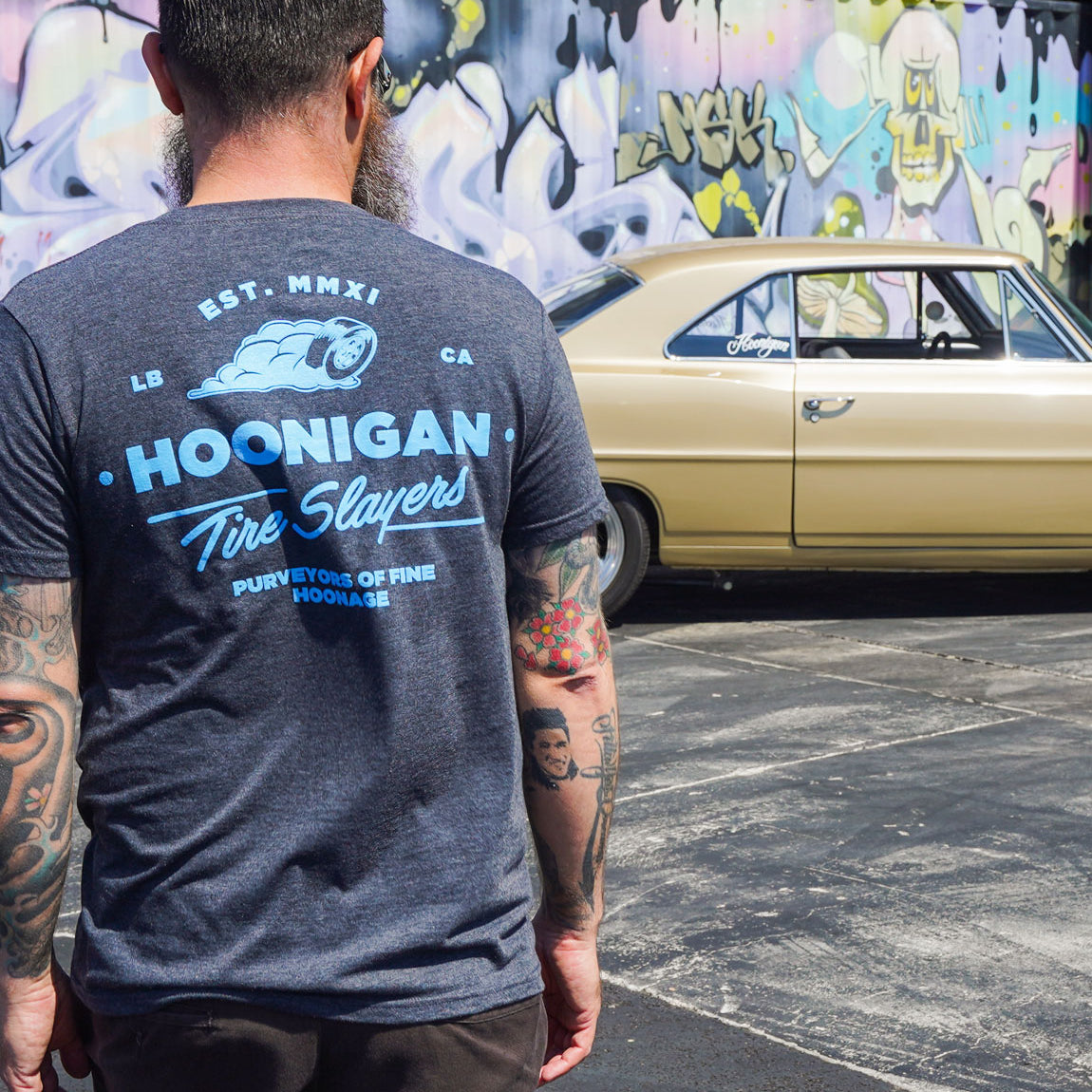 Hoonigan CHEATER SLICKS Short Sleeve Tee in charcoal gray featuring a bold graphic design on the front.