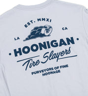 Hoonigan CHEATER SLICKS Short Sleeve Tee in light blue with graphic print on front.