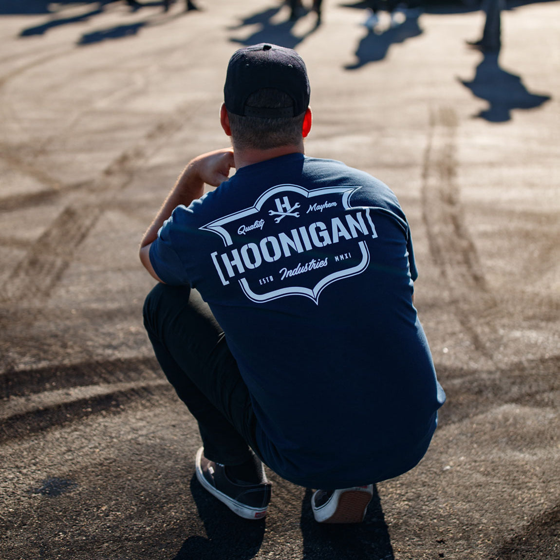 Hoonigan EMBLEM Short Sleeve Tee in navy blue, featuring bold white logo graphic on the front.