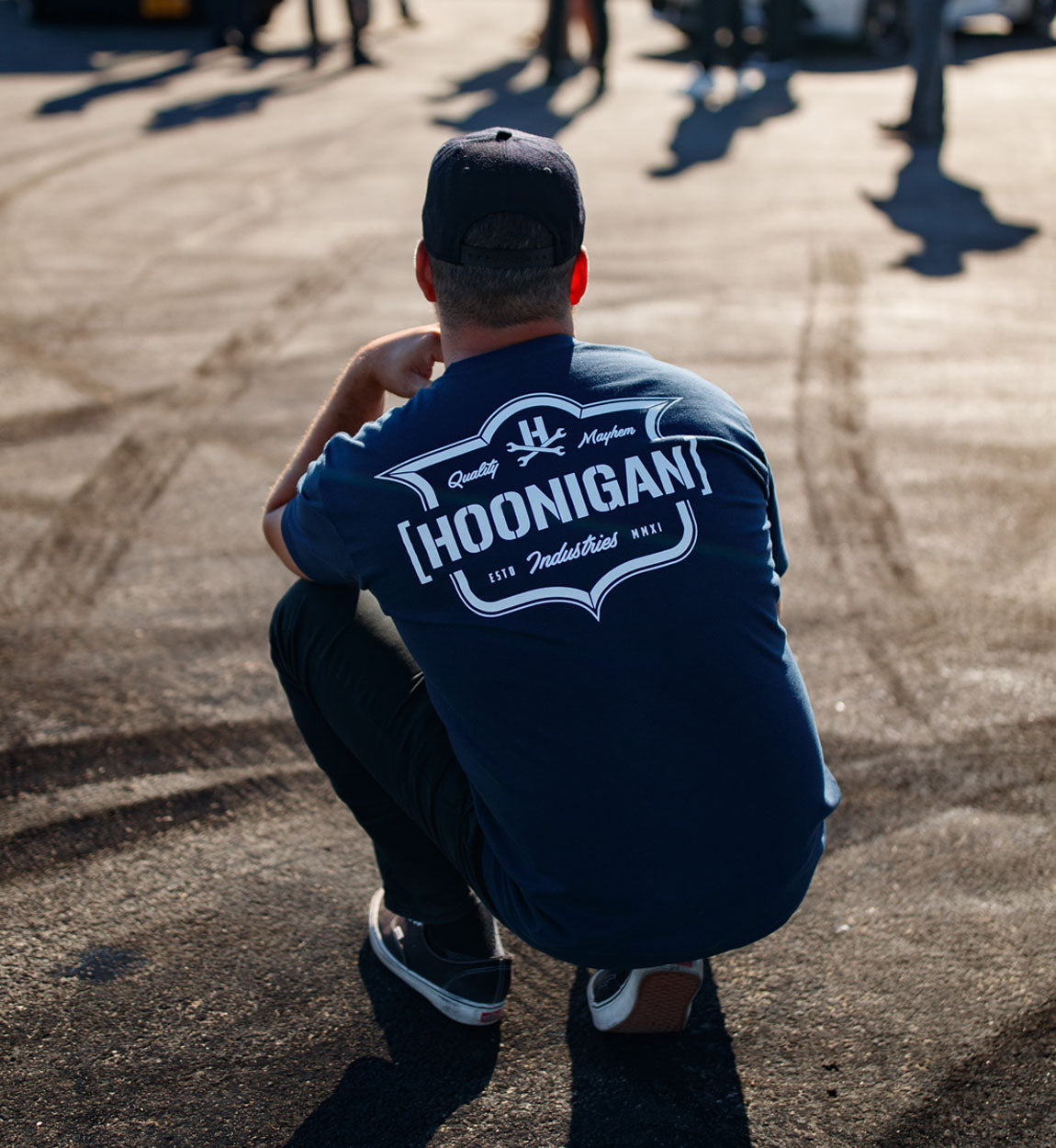 Hoonigan EMBLEM Short Sleeve Tee in navy blue, featuring bold white logo graphic on the front.