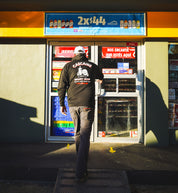 Hoonigan CARCAINE SUPPORT GROUP black pullover hoodie with white logo and graphic design.