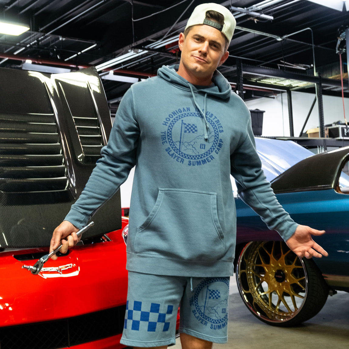 Hoonigan TIRE SLAYER SUMMER CAMP Shorts in light blue featuring a black graphic print and elastic waistband.