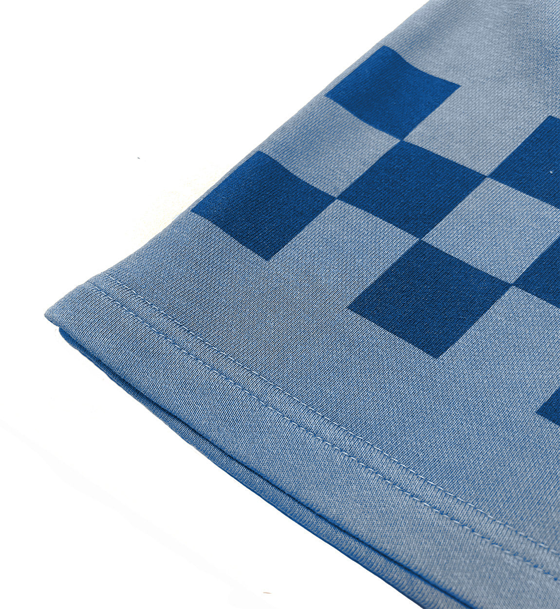 Hoonigan Tire Slayer Summer Camp shorts featuring a vibrant graphic design, elastic waistband, and side pockets, displayed on a wooden surface.